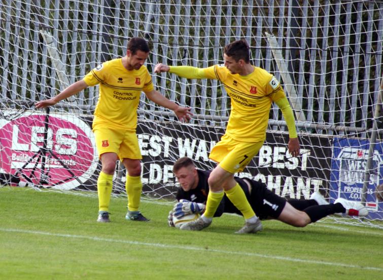 Newtown keeper David Jones gathers inside the box
